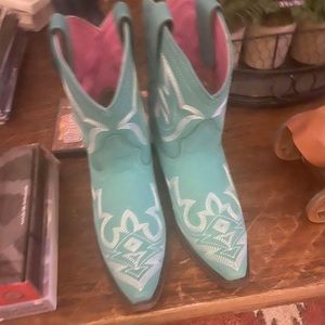 These boots are like new.  Worn one time.  Turquoise color.